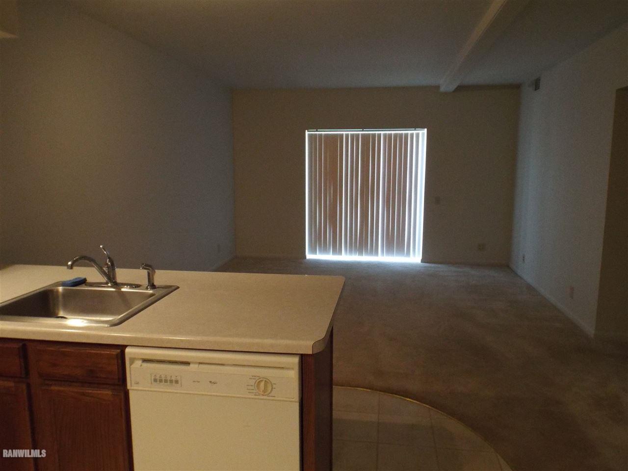 10110 Getz Road Mount Carroll, IL 61053 - Photo 3 of 18 a kitchen that has a sink and a stove