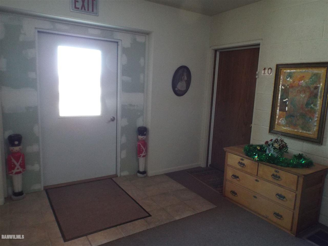 10110 Getz Road Mount Carroll, IL 61053 - Photo 6 of 18 a view of room with window and hallway
