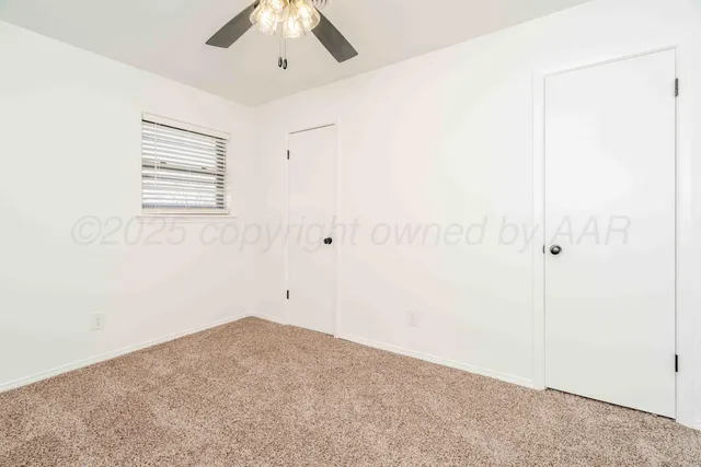 an empty room with a bathroom