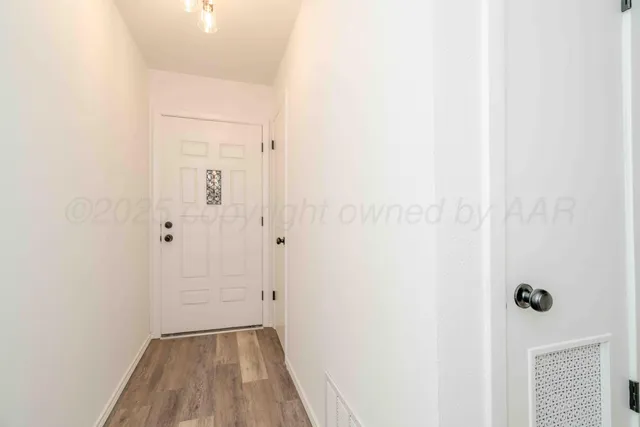 a view of a livingroom with a ceiling fan and window