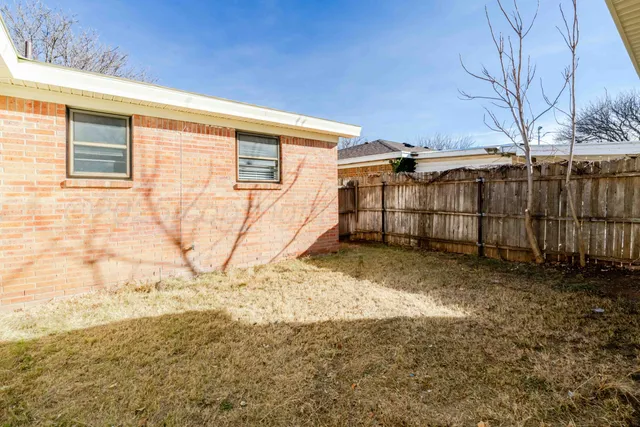 a view of backyard with green space