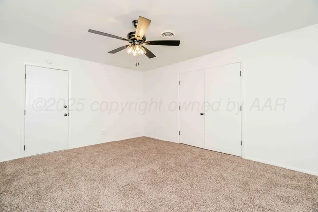 a kitchen with stainless steel appliances a sink cabinets and wooden floor
