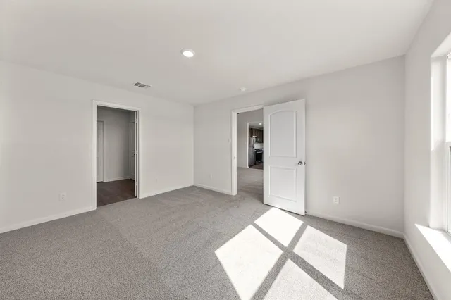 a view of an empty room and window