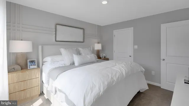 a bedroom with a bed and a lamp