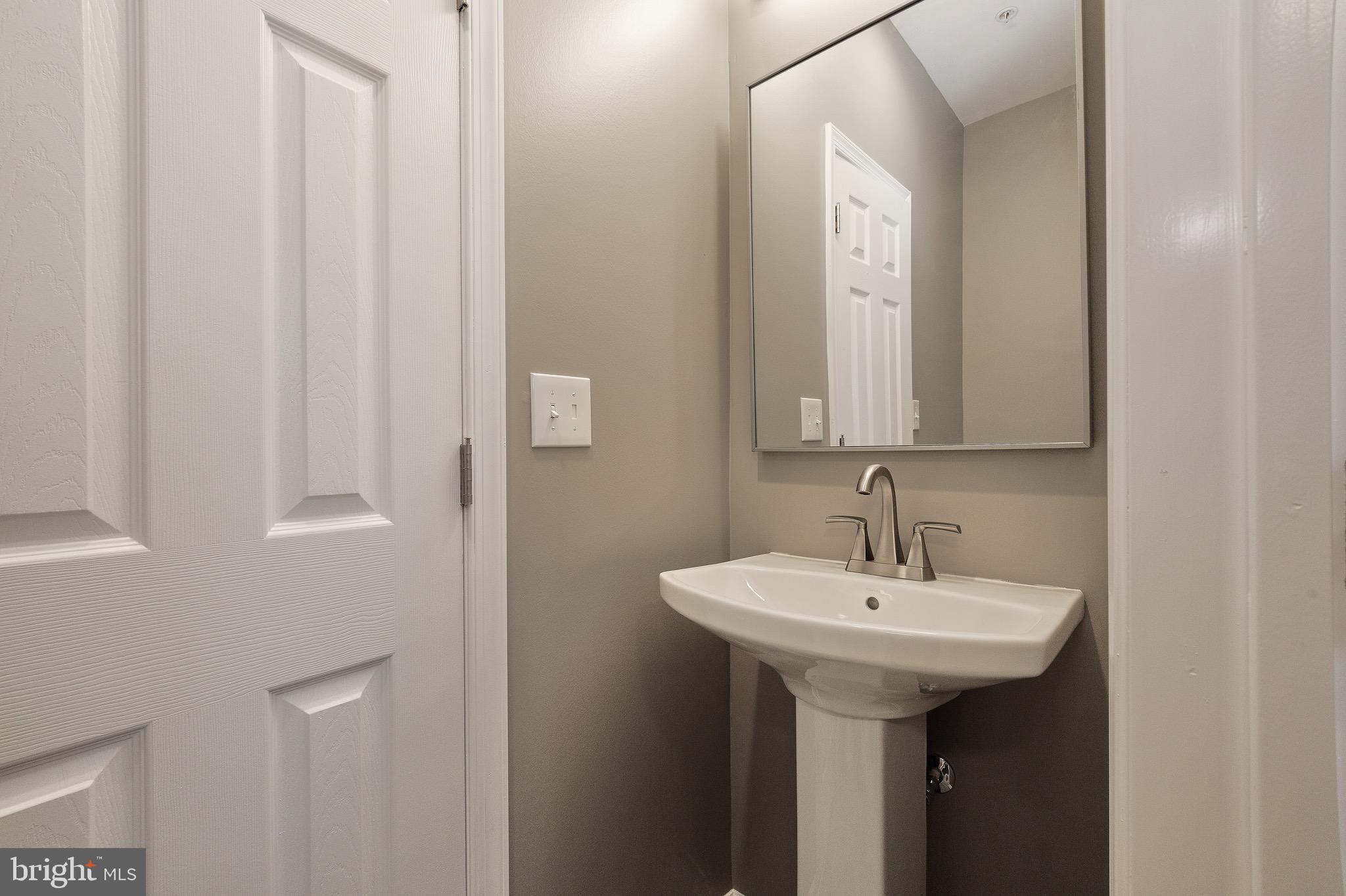 7817 Fairgreen Road Dundalk, MD 21222 - Photo 55 of 57 PRIVATE SINK & TOILET OF THE 3RD BATH