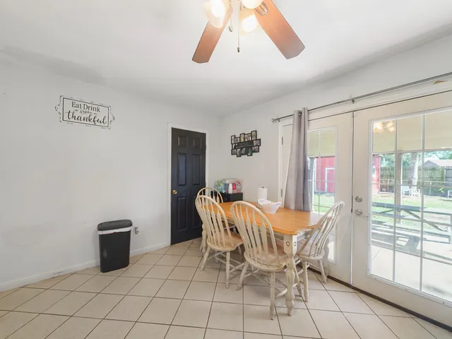 a dining room with furniture and window