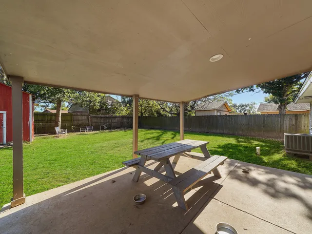 a view of a park with a large tree