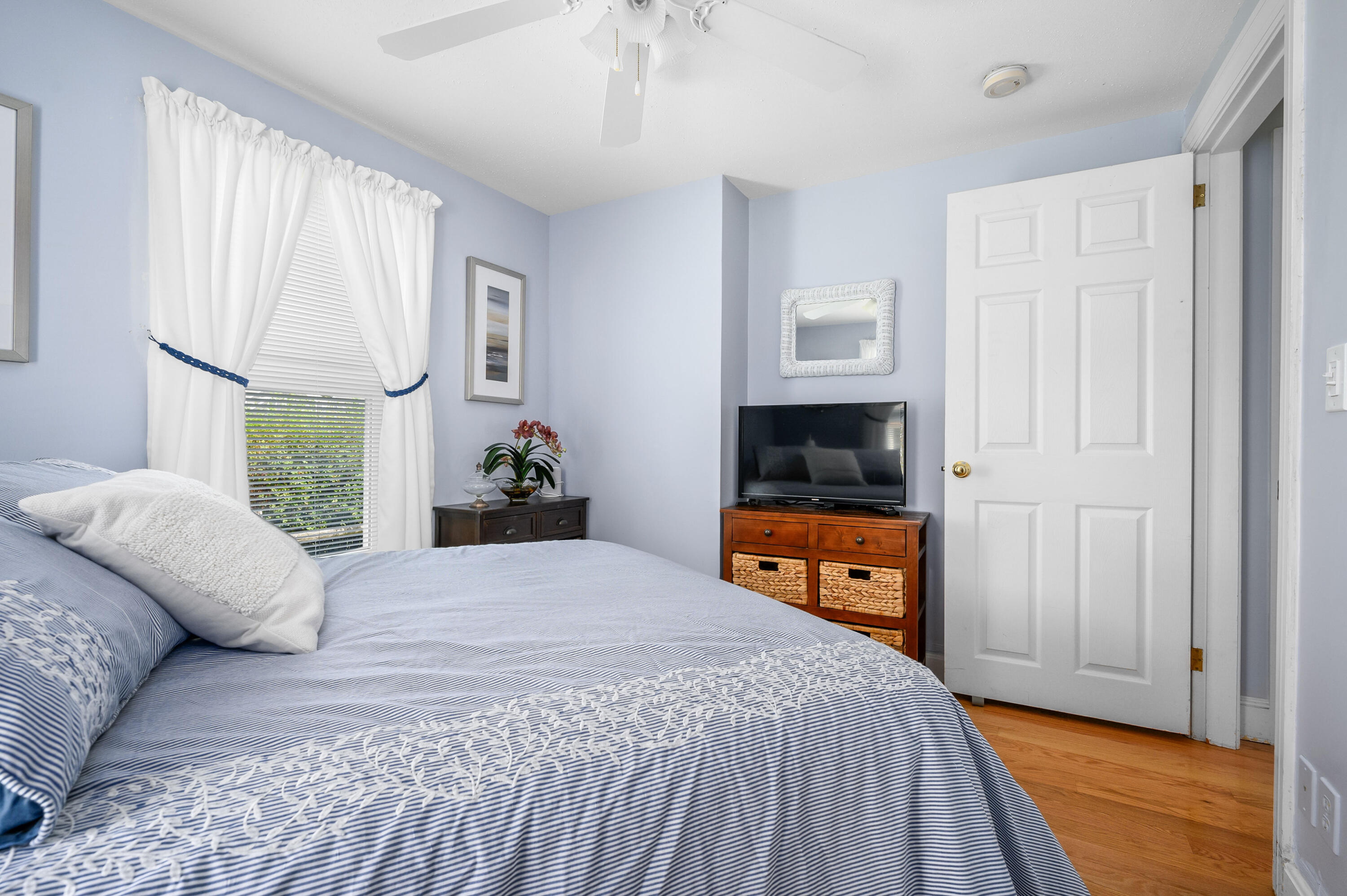45 First Way Barnstable, MA 02630 - Photo 22 of 30 a bedroom with a bed and a large window