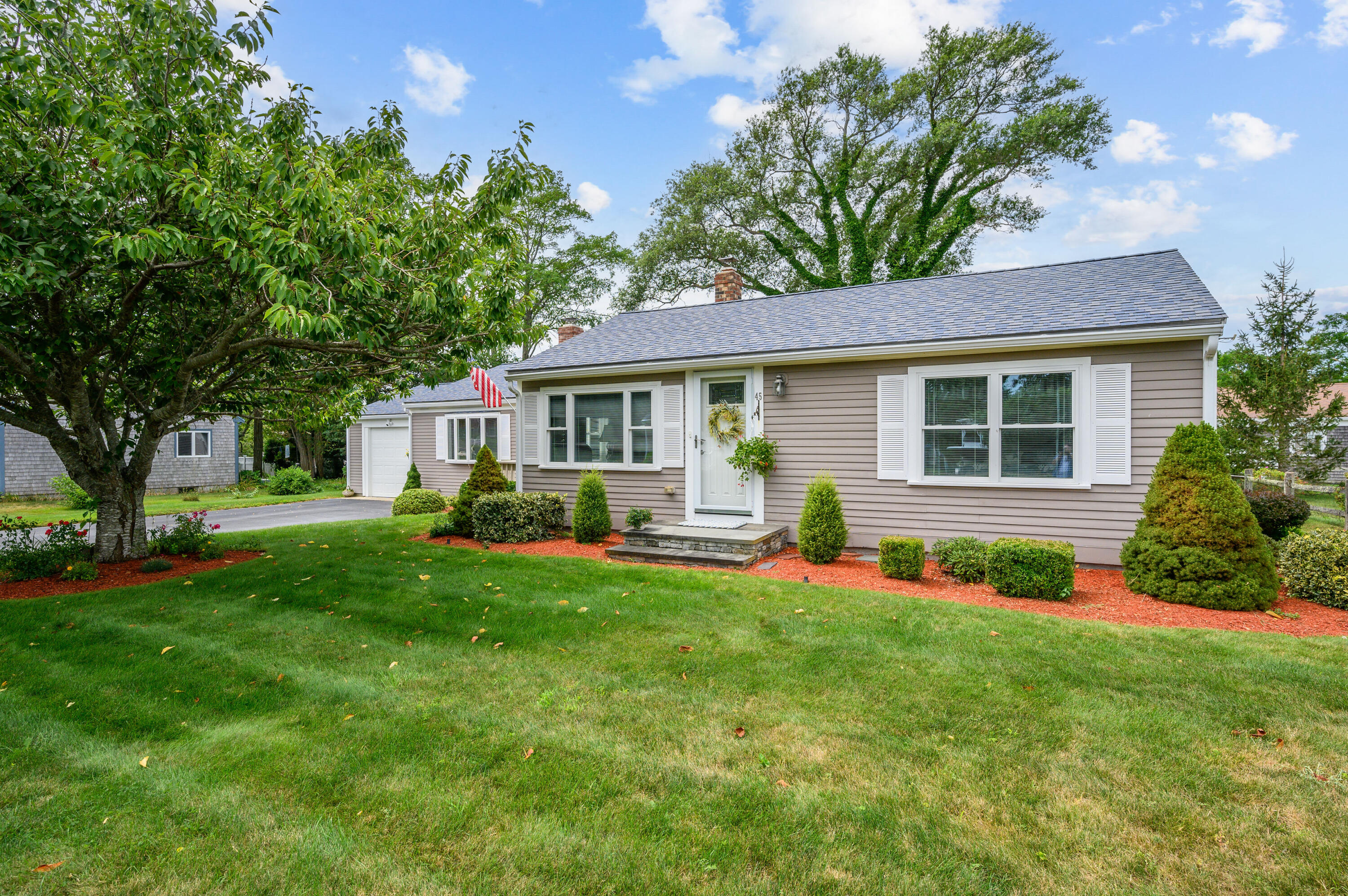 45 First Way Barnstable, MA 02630 - Photo 27 of 30 a front view of house with yard and green space