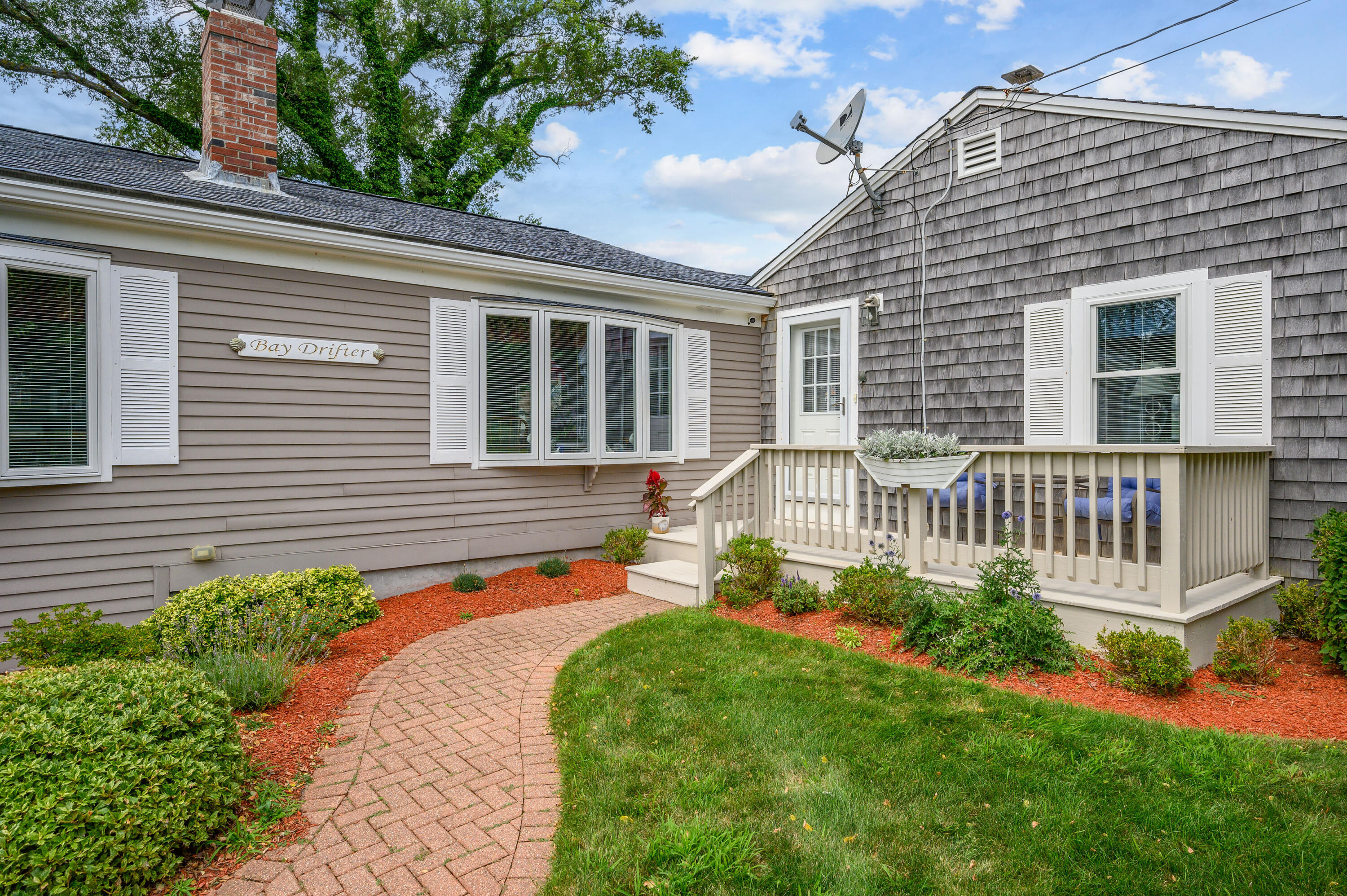 45 First Way Barnstable, MA 02630 - Photo 3 of 30 a front view of a house with a yard