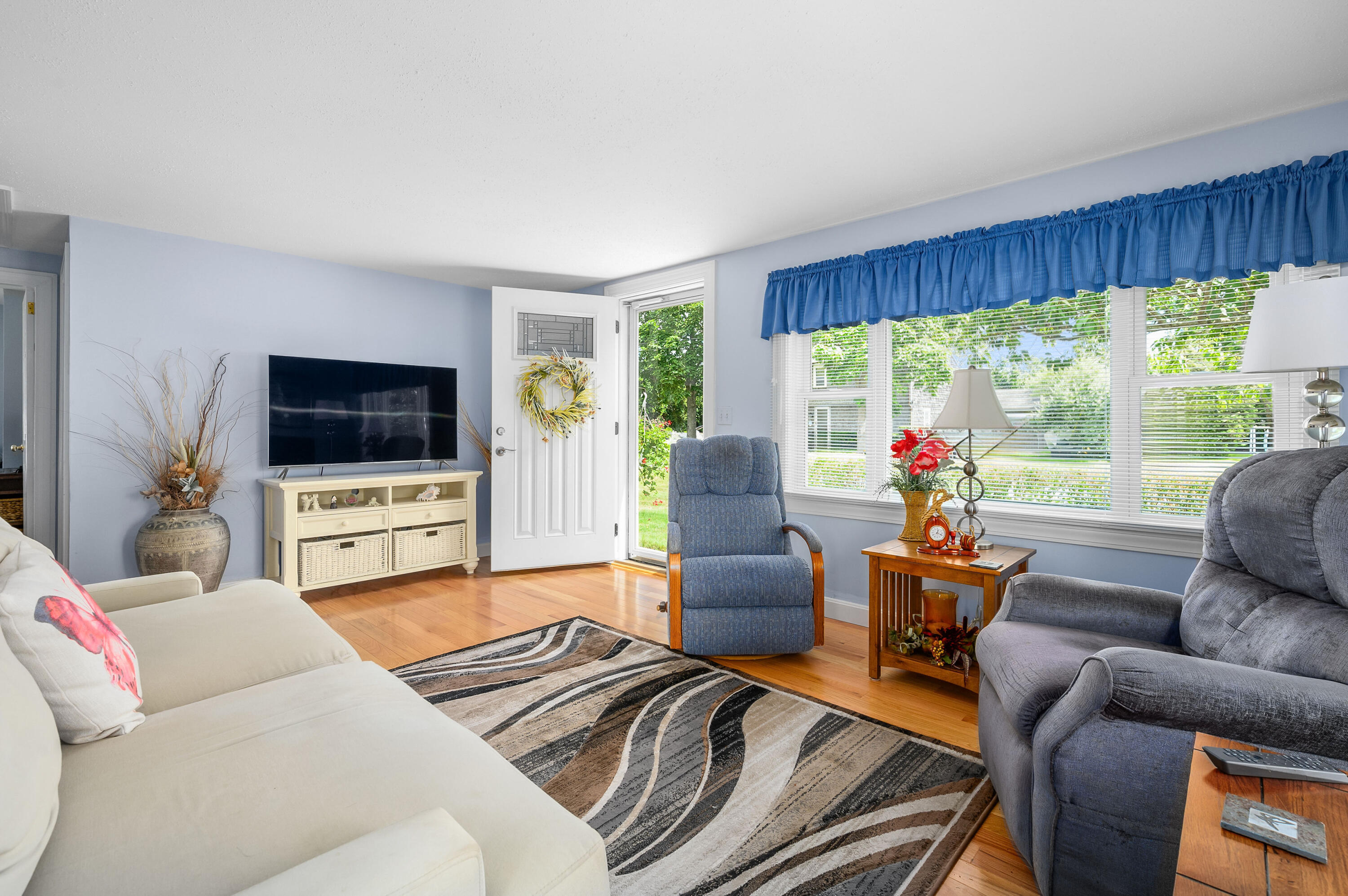 45 First Way Barnstable, MA 02630 - Photo 5 of 30 a living room with furniture a flat screen tv and a large window