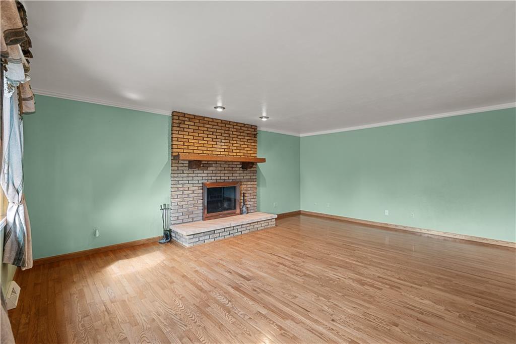 2807 Russelton Road Tarentum, PA 15084 - Photo 13 of 28 a view of empty room with wooden floor and fireplace