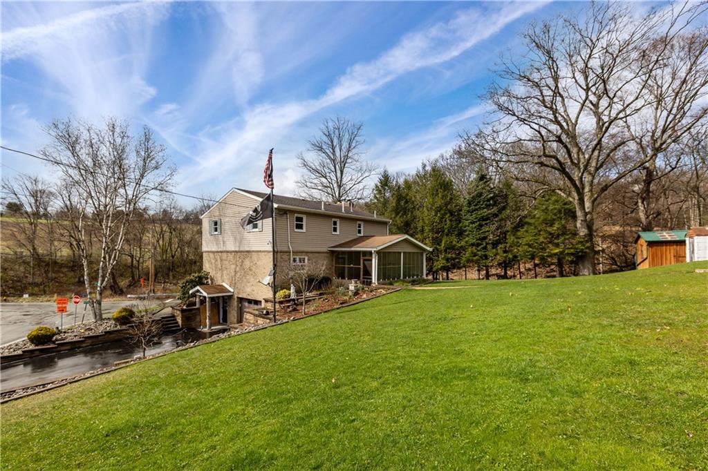 2807 Russelton Road Tarentum, PA 15084 - Photo 4 of 28 a view of a house with a big yard and sitting area