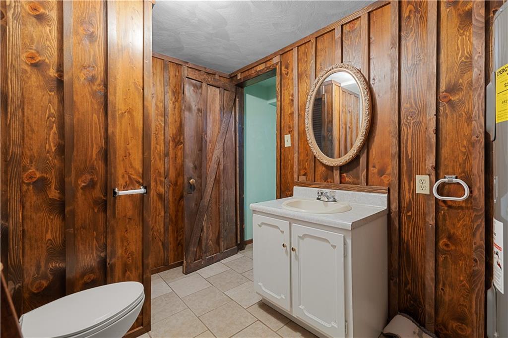 2807 Russelton Road Tarentum, PA 15084 - Photo 8 of 28 a bathroom with a sink a toilet and shower curtain