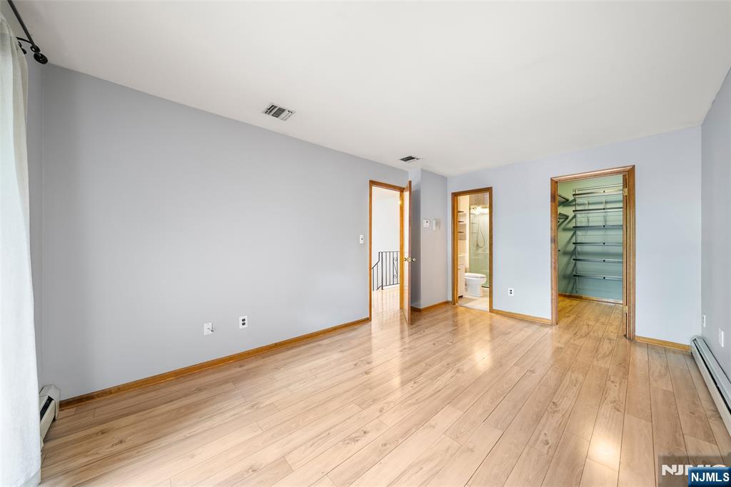 140 Allwood Road, Unit C Clifton, NJ 07012 - Photo 21 of 31 a view of an empty room with wooden floor and closet