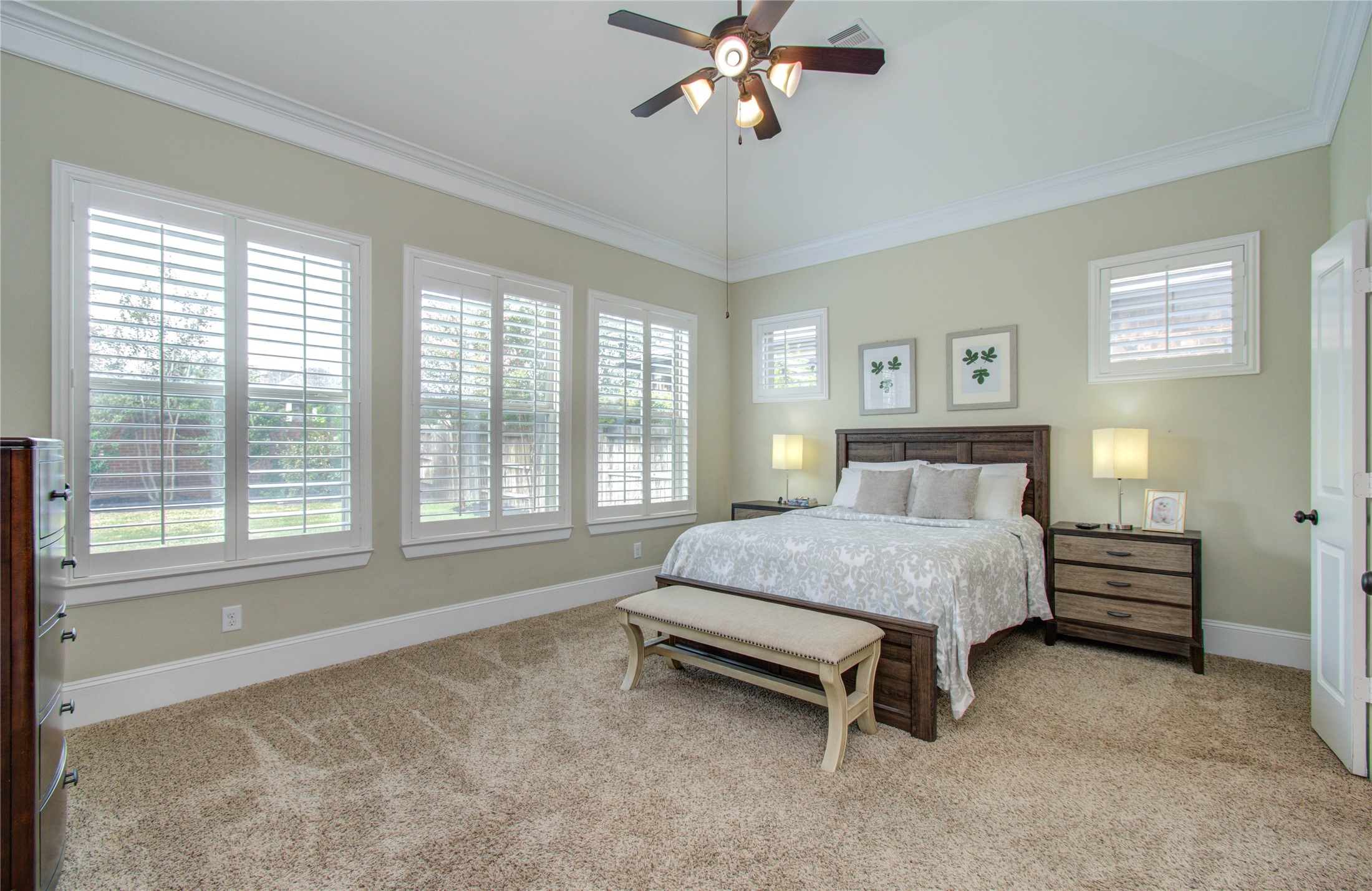 28627 Rolling Ridge Drive Katy, TX 77494 - Photo 22 of 44 a spacious bedroom with a bed and a chandelier