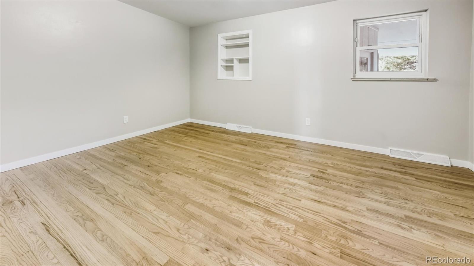 1201 Reed Street Lakewood, CO 80214 - Photo 19 of 44 a view of empty room with wooden floor