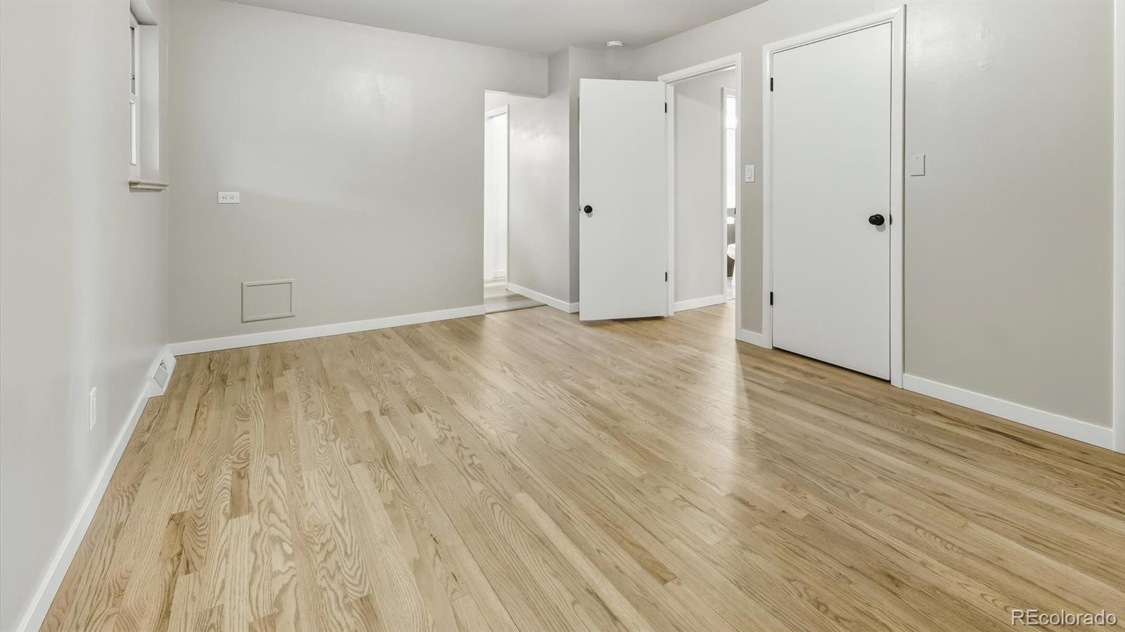 1201 Reed Street Lakewood, CO 80214 - Photo 20 of 44 a view of an empty room with wooden floor