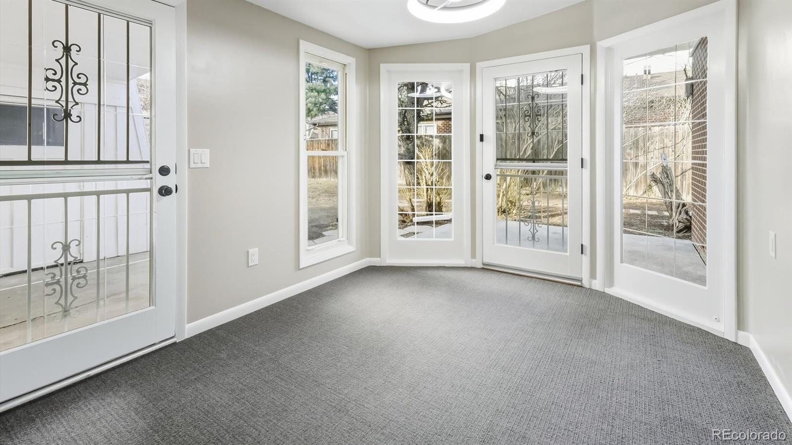 1201 Reed Street Lakewood, CO 80214 - Photo 26 of 44 an empty room with windows