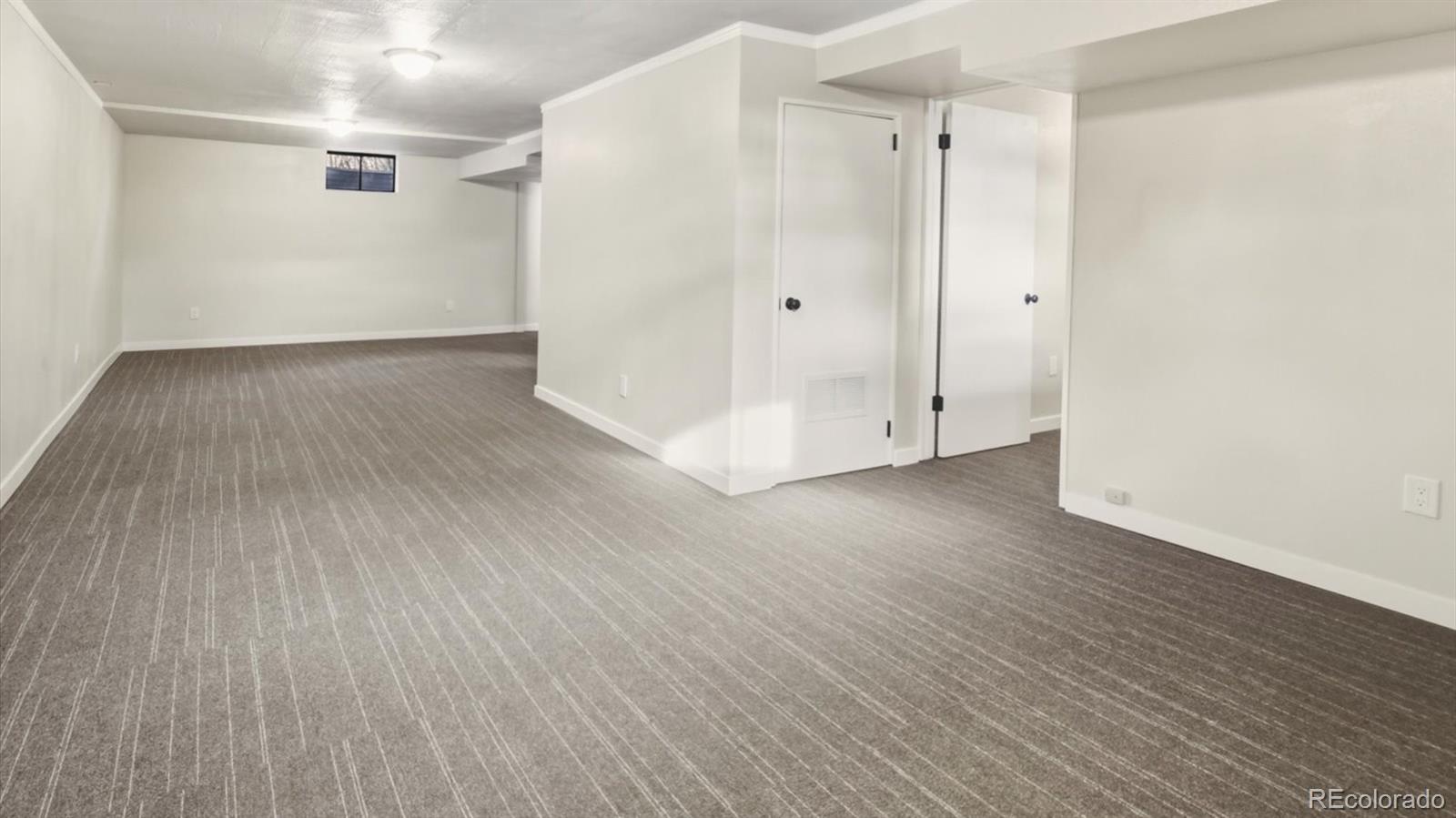 1201 Reed Street Lakewood, CO 80214 - Photo 29 of 44 a view of an empty room with wooden floor