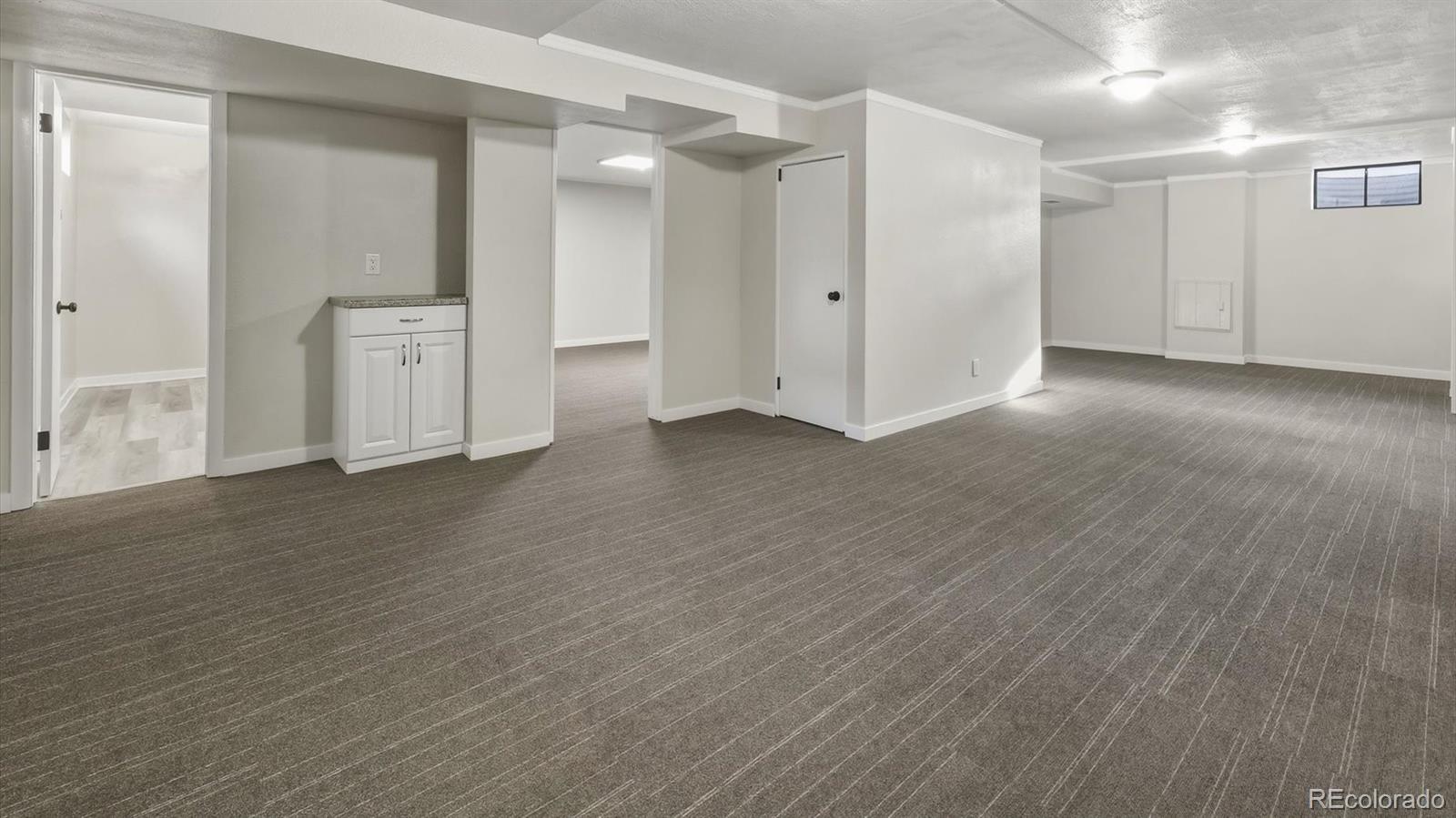 1201 Reed Street Lakewood, CO 80214 - Photo 30 of 44 a view of empty room with wooden floor