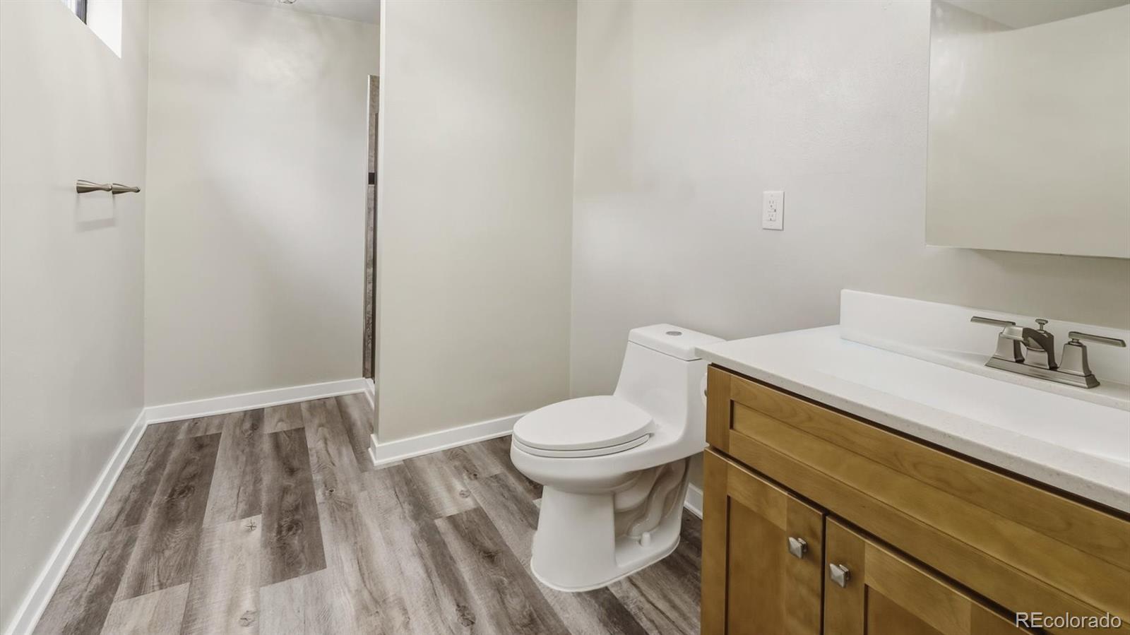 1201 Reed Street Lakewood, CO 80214 - Photo 31 of 44 a bathroom with a sink and a toilet