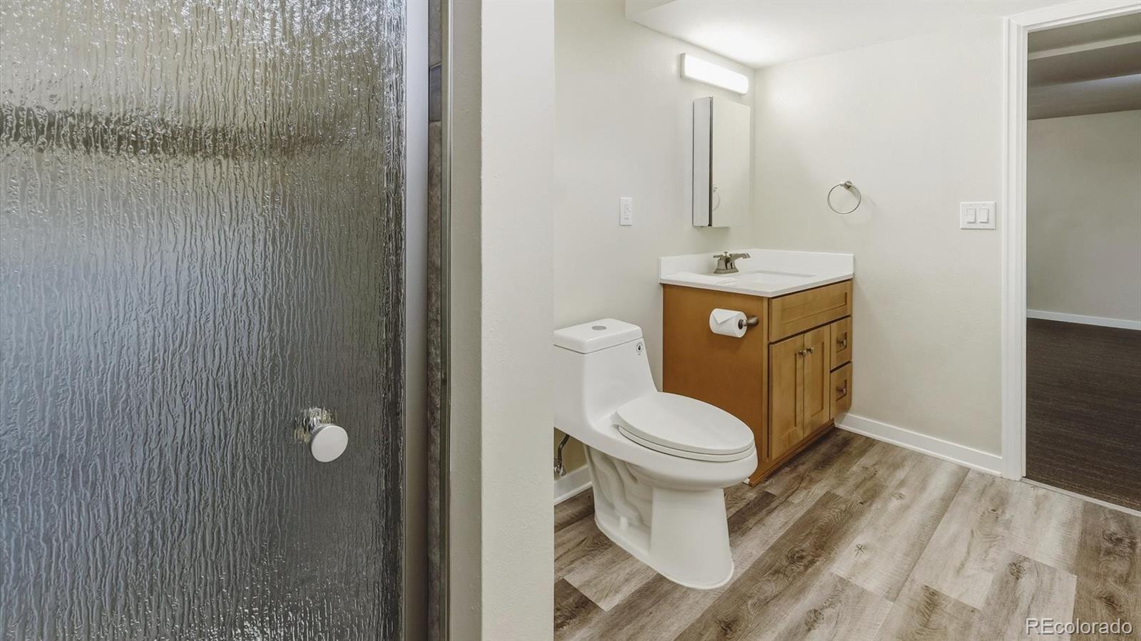 1201 Reed Street Lakewood, CO 80214 - Photo 32 of 44 a bathroom with a toilet and a sink
