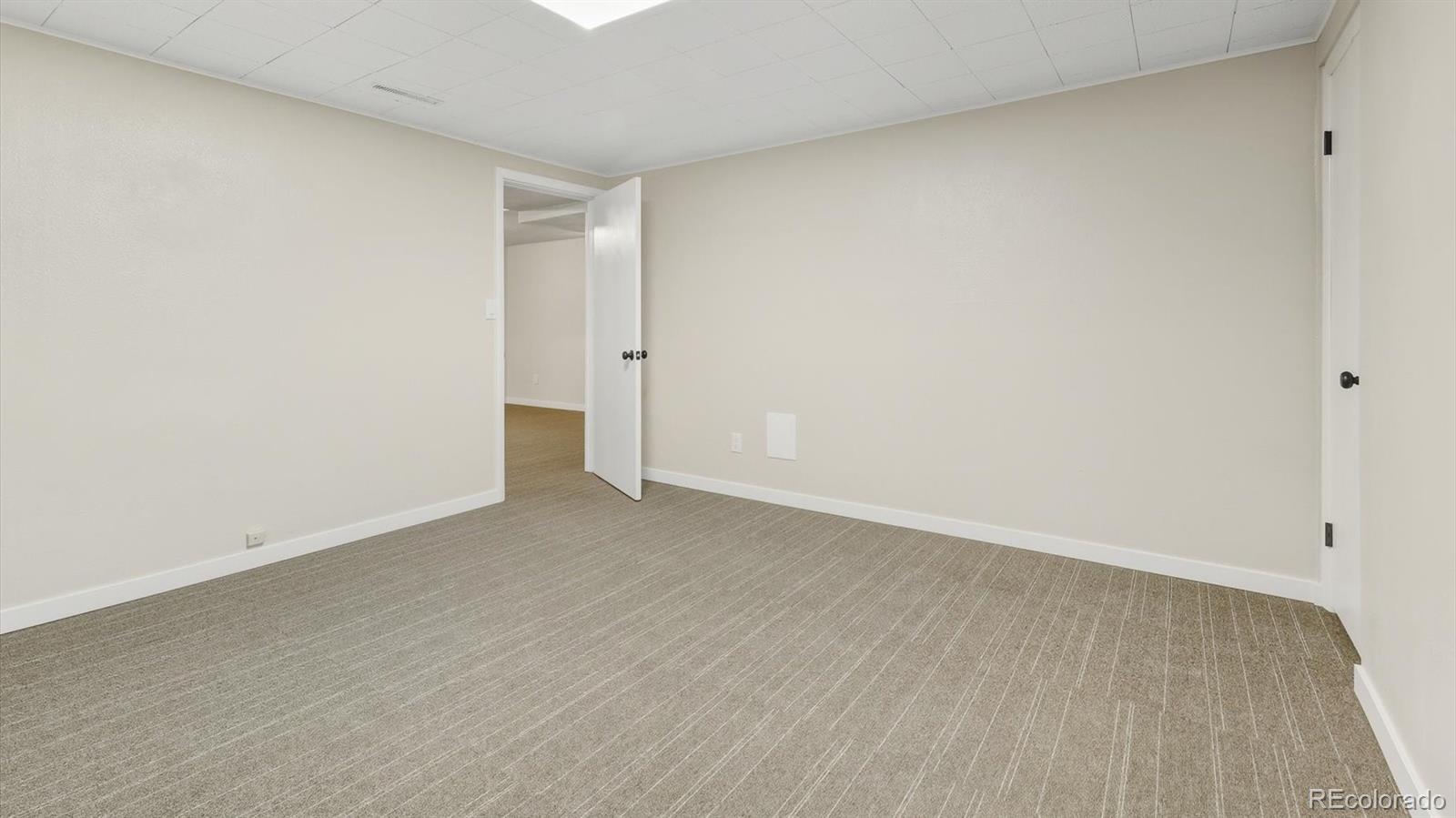 1201 Reed Street Lakewood, CO 80214 - Photo 34 of 44 a view of an empty room and wooden floor