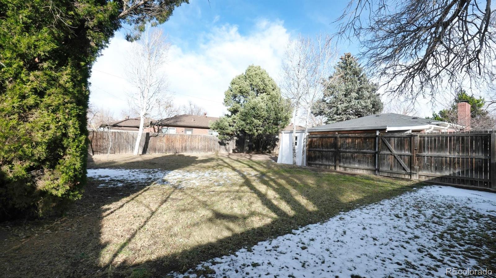 1201 Reed Street Lakewood, CO 80214 - Photo 43 of 44 a view of a backyard with swimming pool