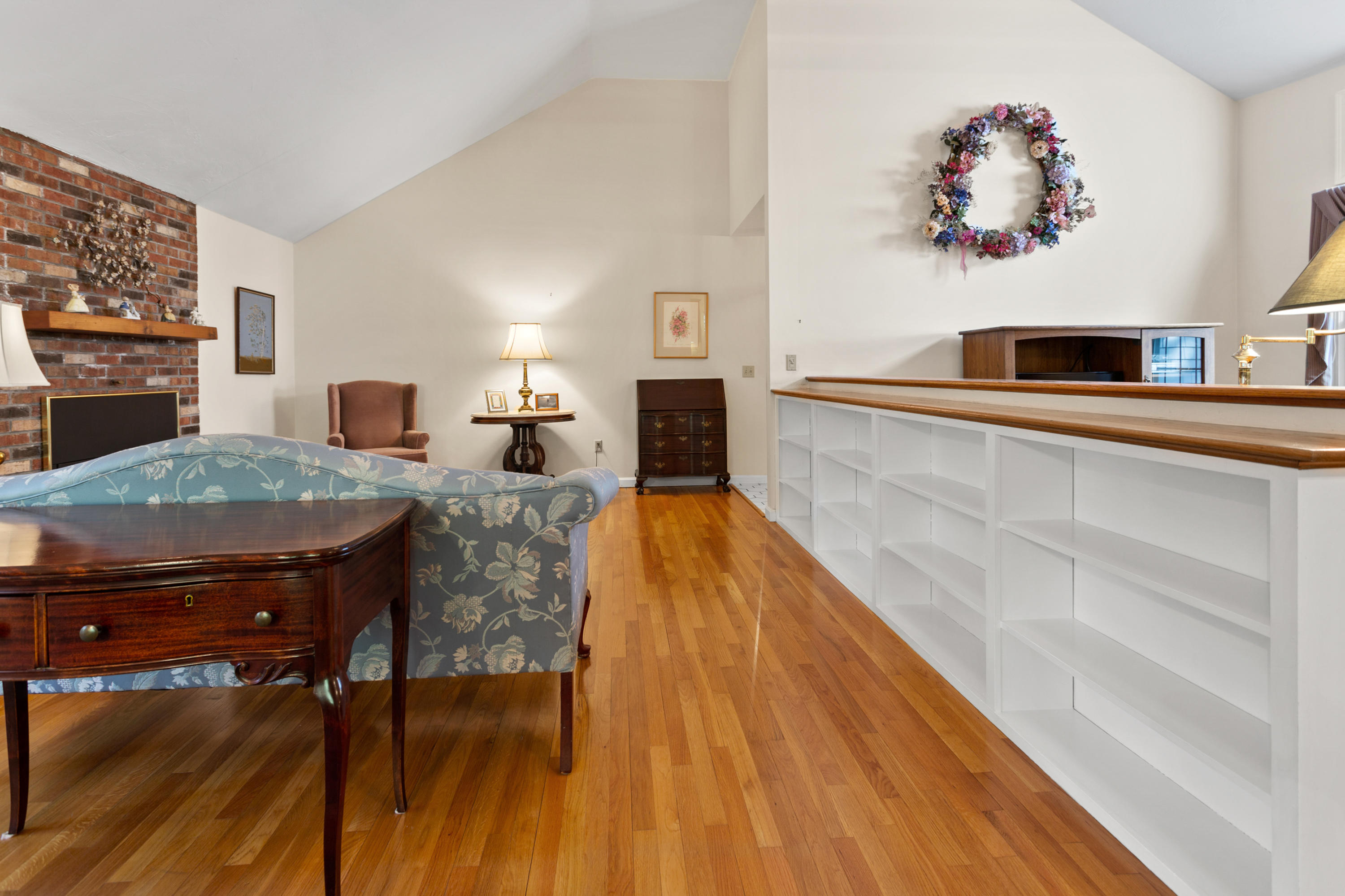 82 Clamshell Cove Road Cotuit, MA 02635 - Photo 12 of 34 a living room with furniture and a wooden floor