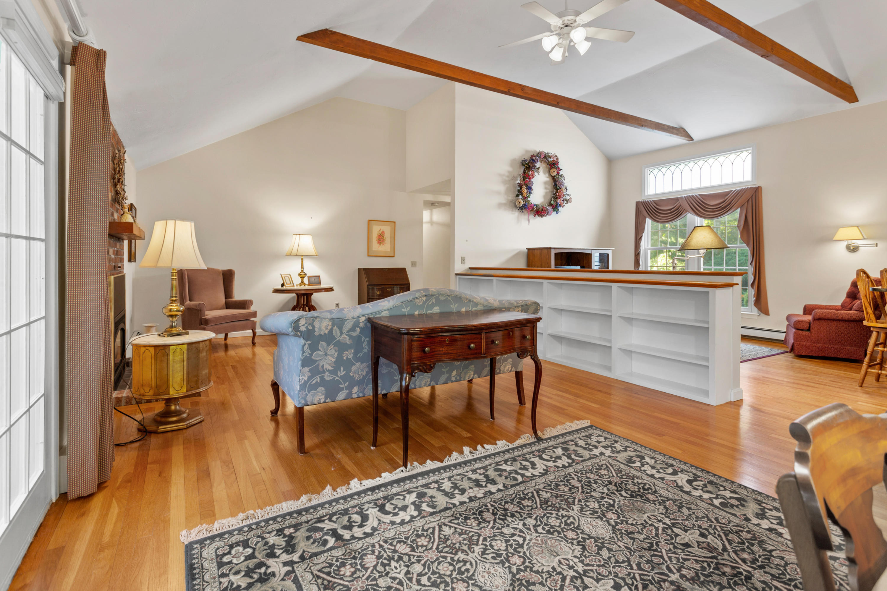 82 Clamshell Cove Road Cotuit, MA 02635 - Photo 13 of 34 a living room with furniture and a wooden floor