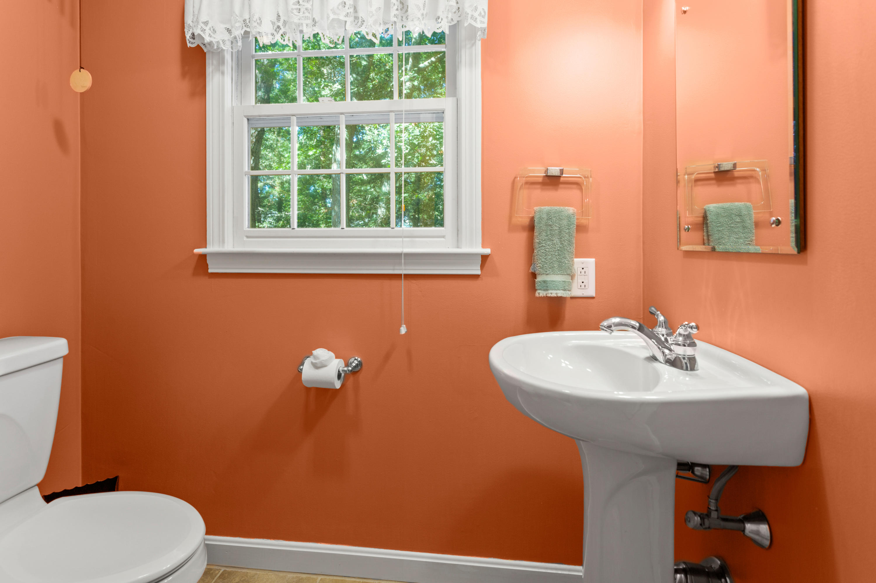 82 Clamshell Cove Road Cotuit, MA 02635 - Photo 23 of 34 a bathroom with a sink a mirror and a toilet