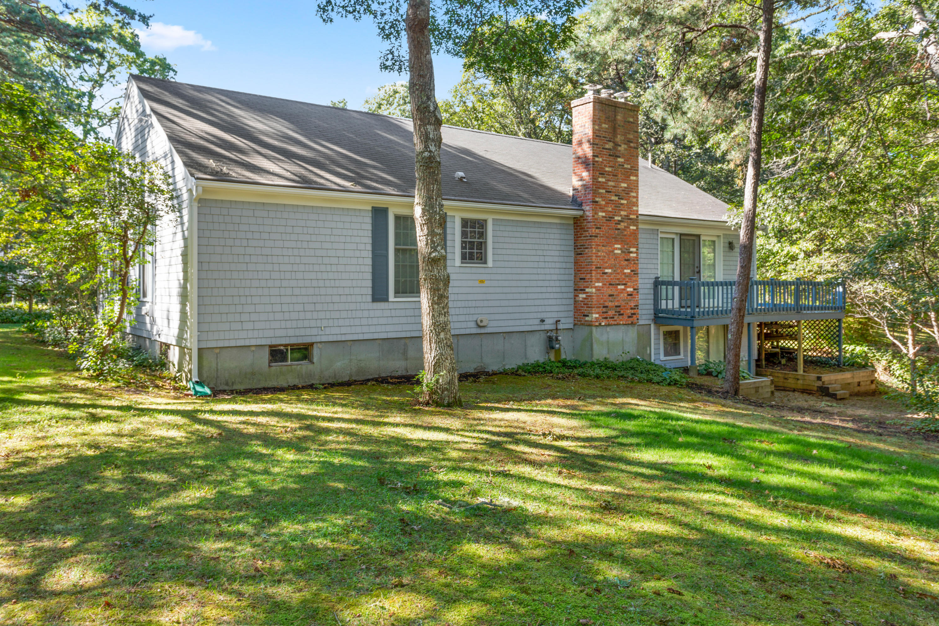 82 Clamshell Cove Road Cotuit, MA 02635 - Photo 30 of 34 a view of a house with a patio