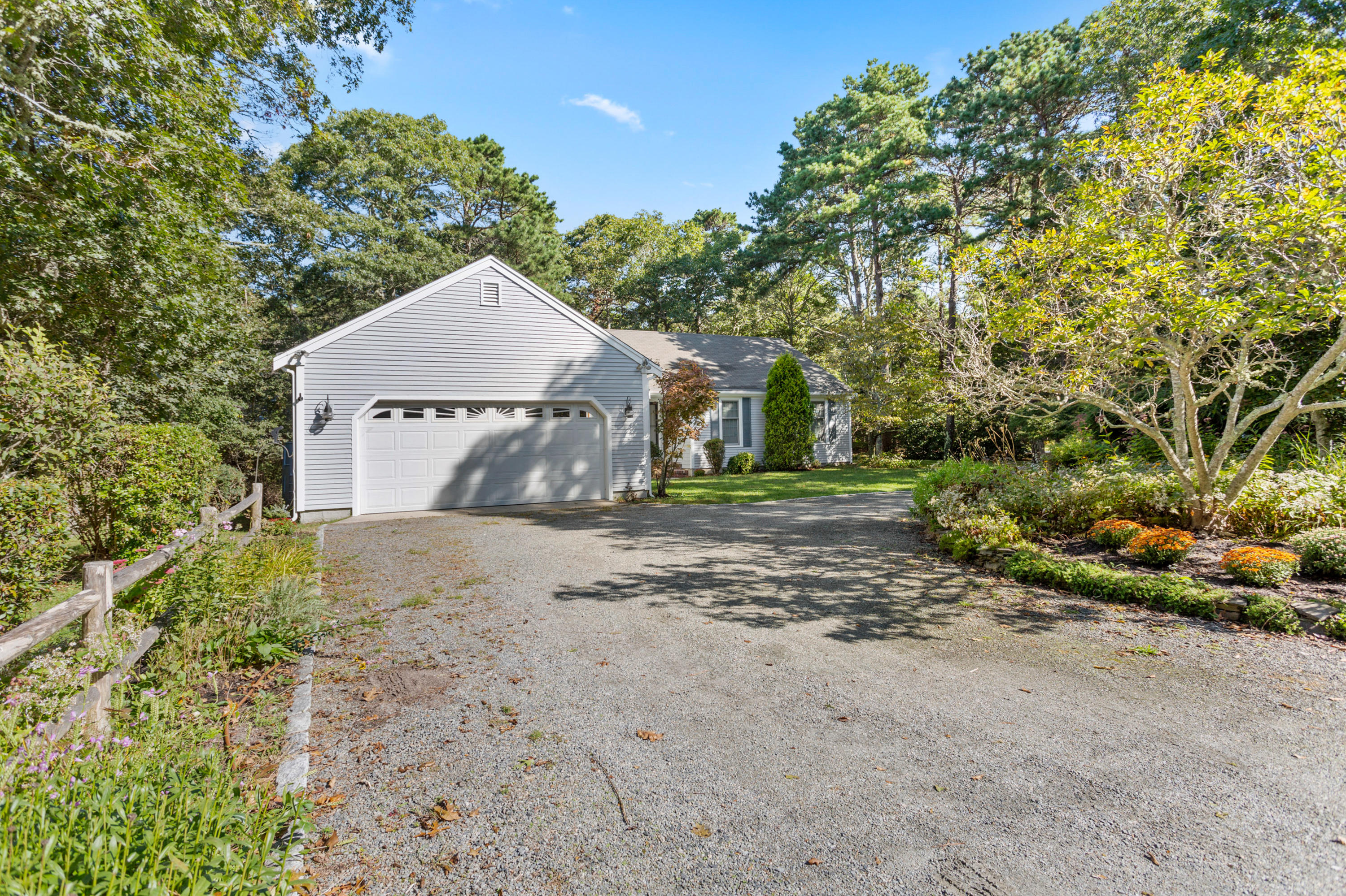 82 Clamshell Cove Road Cotuit, MA 02635 - Photo 3 of 34 a aerial view of a house with a yard and garage