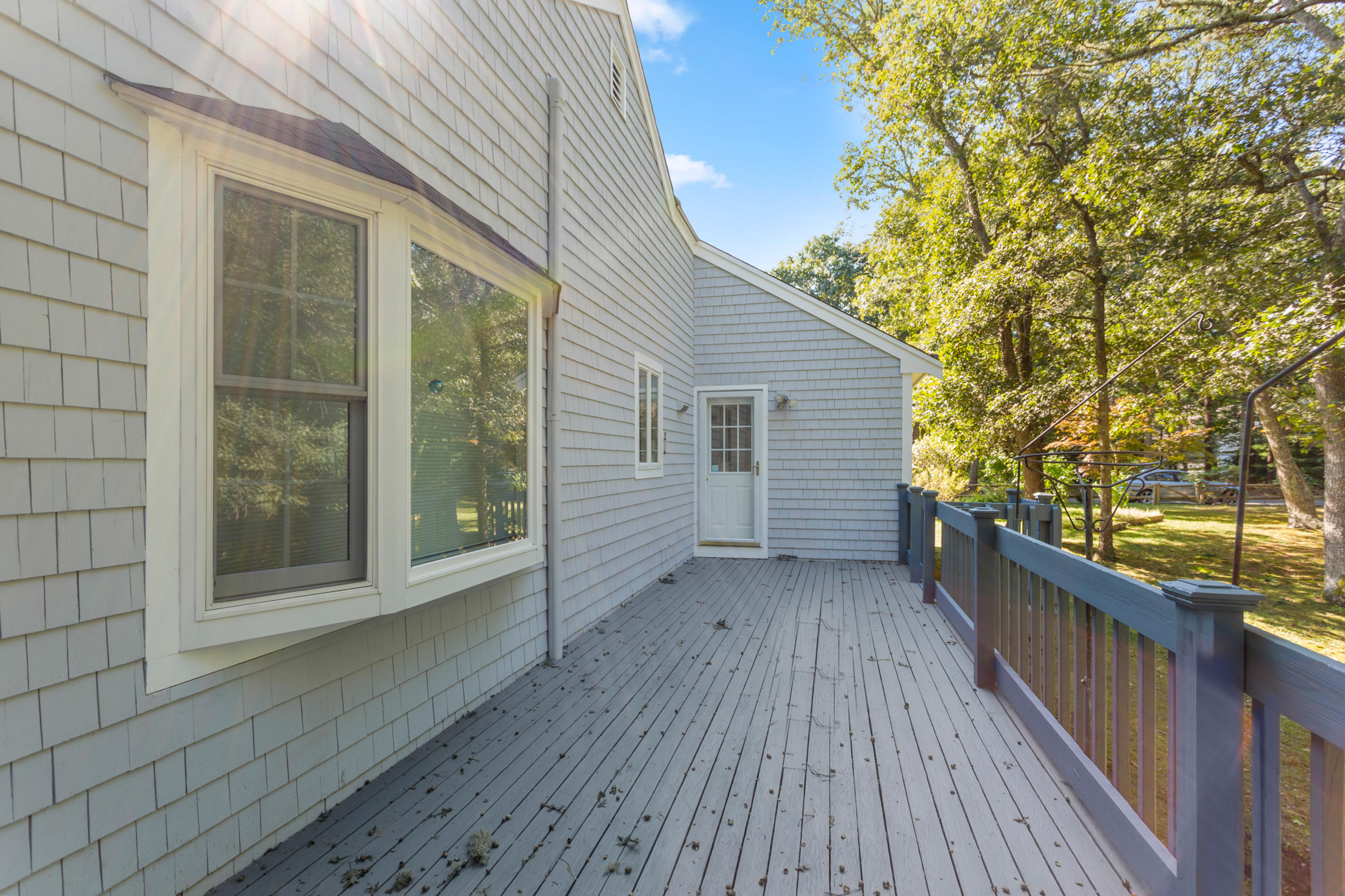 82 Clamshell Cove Road Cotuit, MA 02635 - Photo 34 of 34 a view of a house with wooden deck