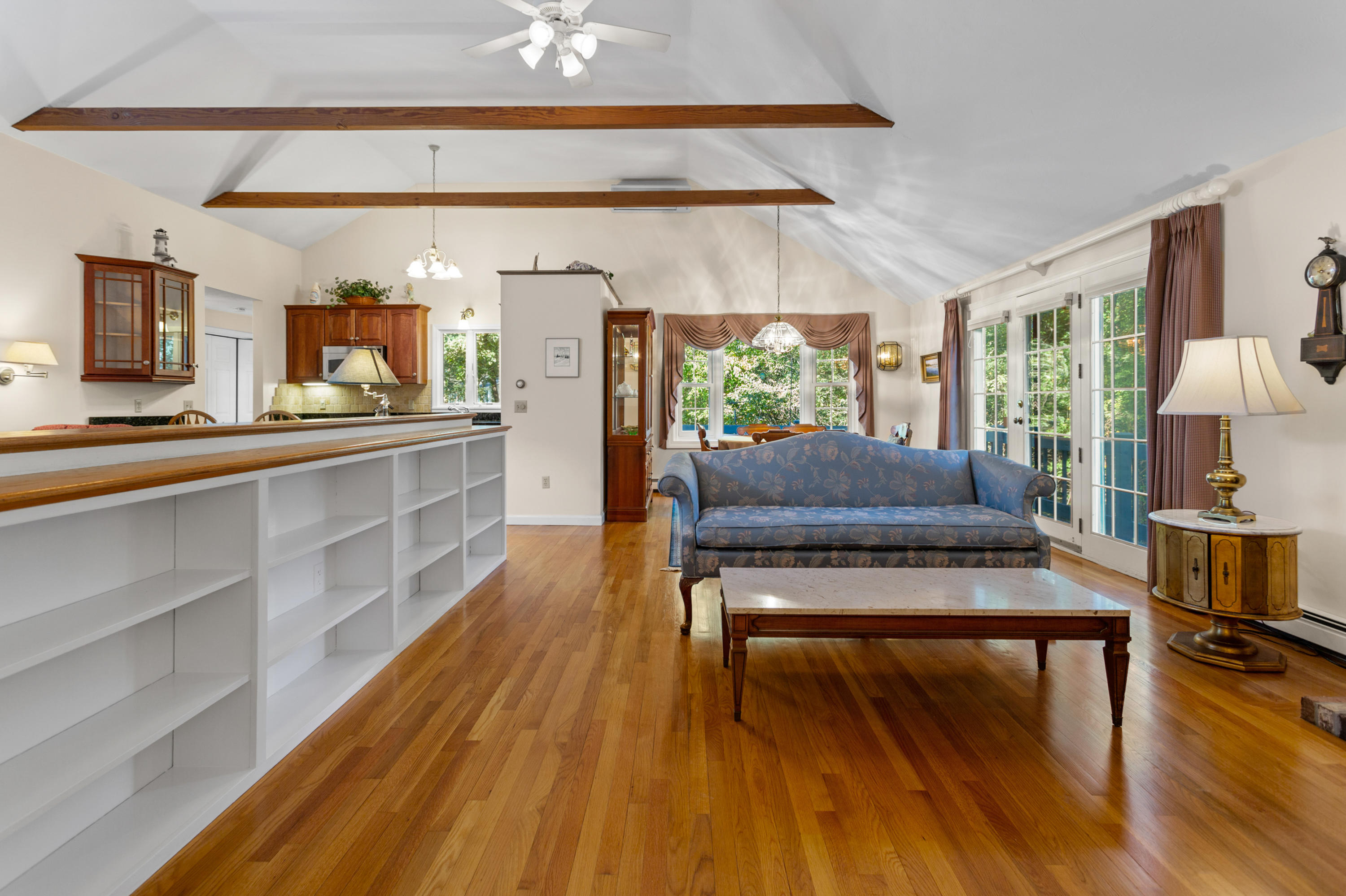 82 Clamshell Cove Road Cotuit, MA 02635 - Photo 7 of 34 a living room with furniture and a wooden floor