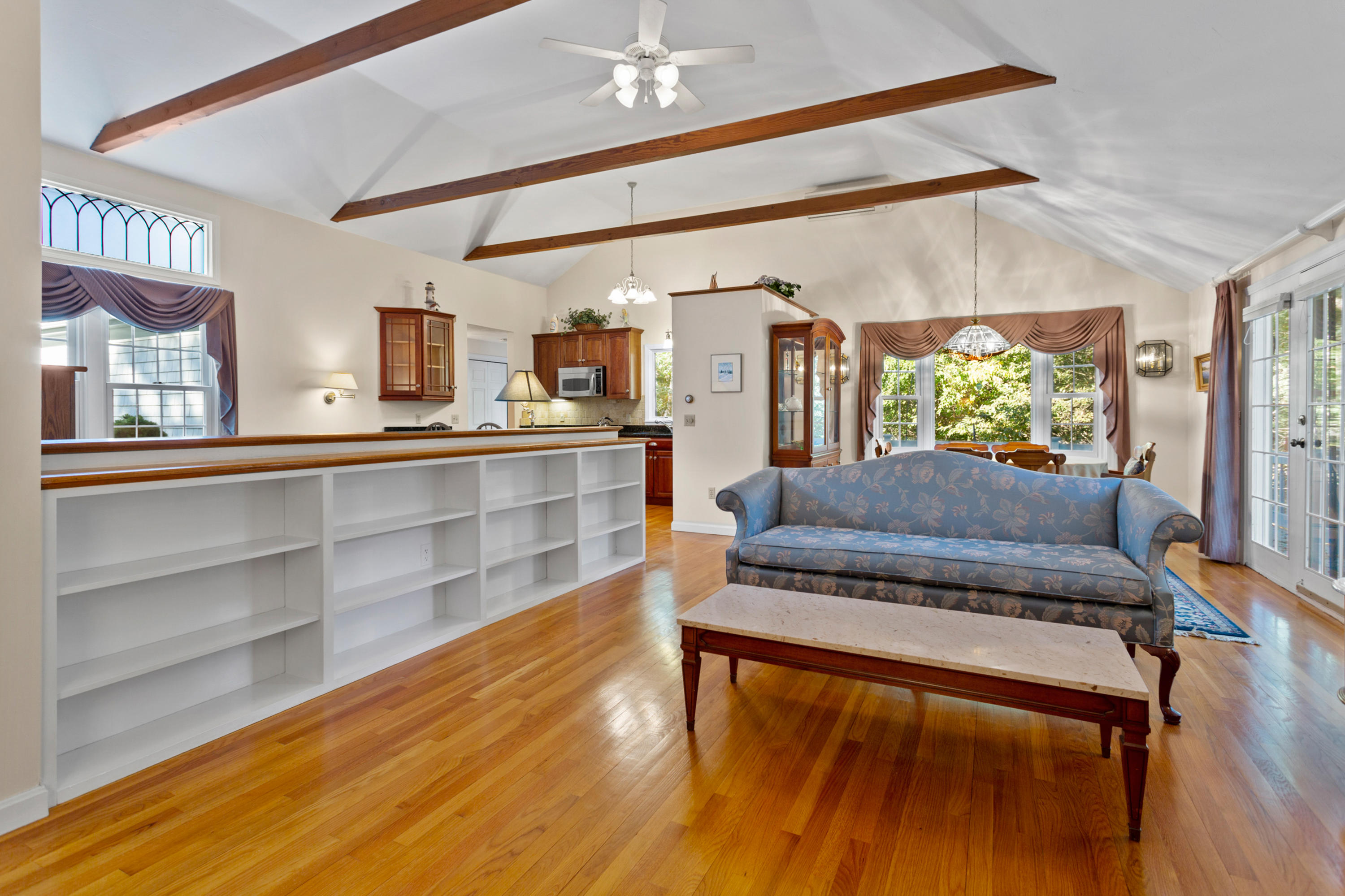 82 Clamshell Cove Road Cotuit, MA 02635 - Photo 9 of 34 a living room with furniture and a large window