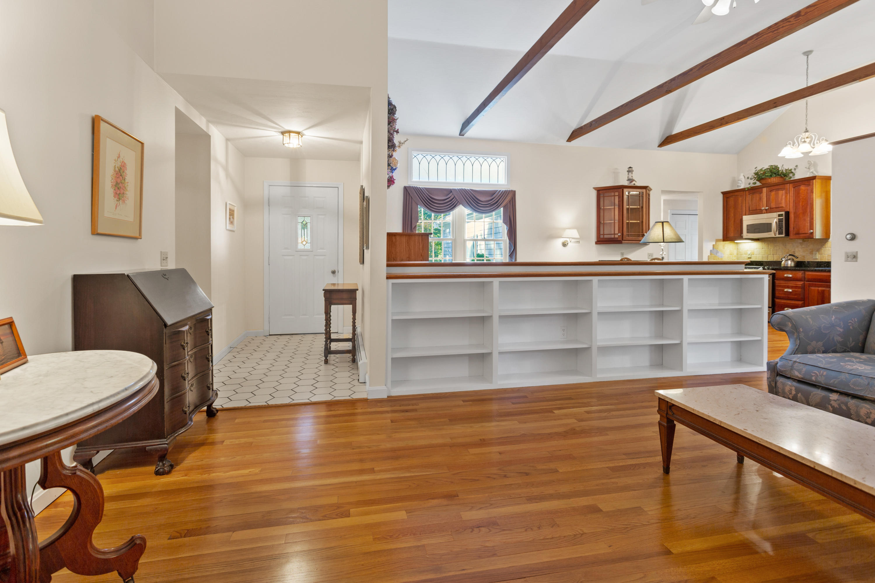 82 Clamshell Cove Road Cotuit, MA 02635 - Photo 10 of 34 a living room with furniture and a wooden floor