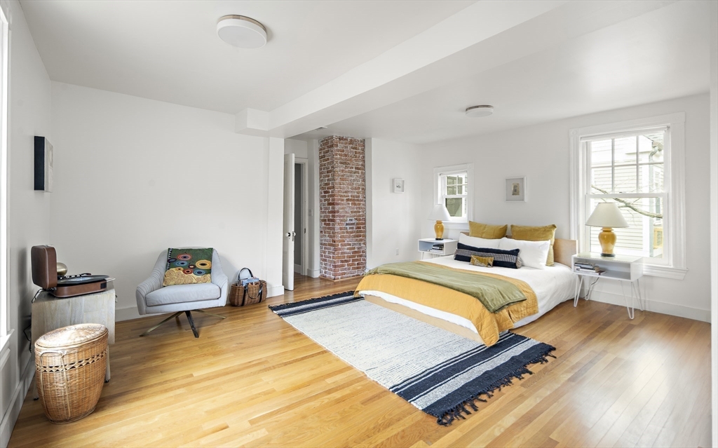 16 Blake Street Cambridge, MA 02140 - Photo 21 of 37 a bedroom with a bed and wooden floor