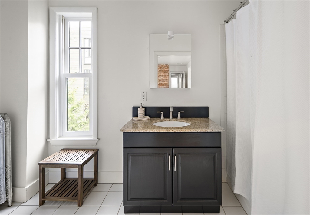 16 Blake Street Cambridge, MA 02140 - Photo 22 of 37 a utility room with a window a sink and a window