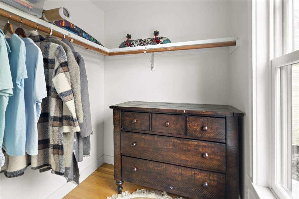16 Blake Street Cambridge, MA 02140 - Photo 23 of 37 a view of walk in closet with clothes and shoes