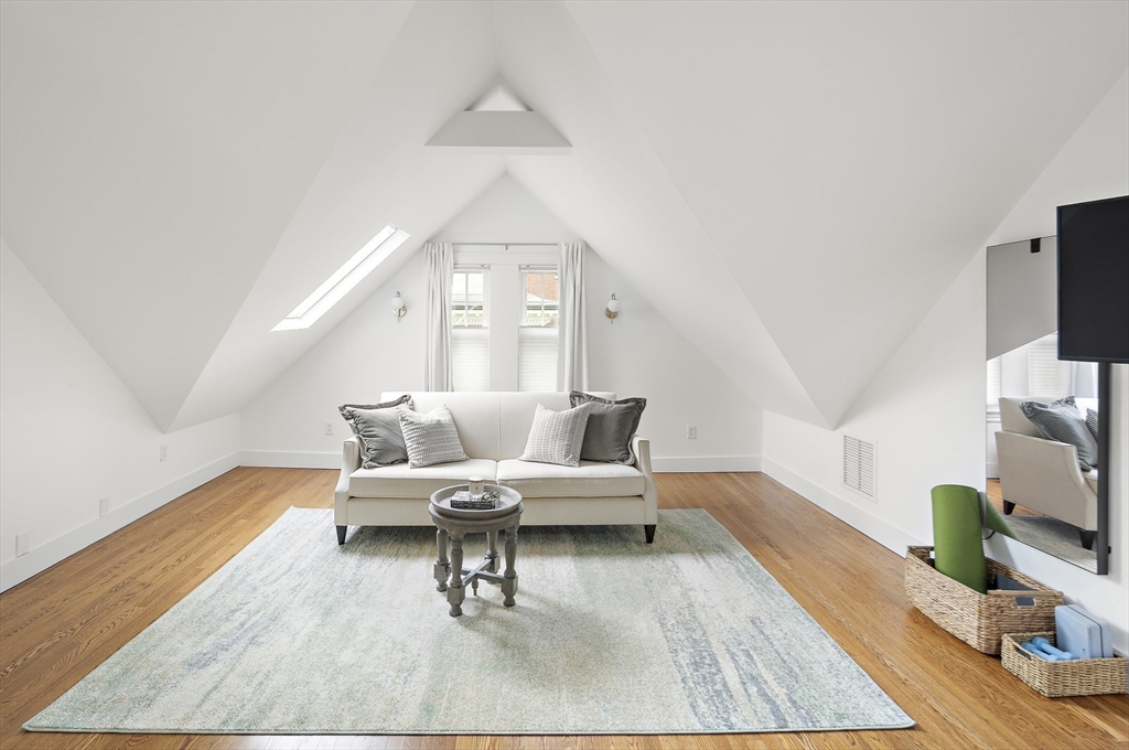 16 Blake Street Cambridge, MA 02140 - Photo 28 of 37 a living room with furniture and a fireplace