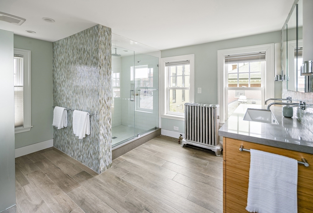 16 Blake Street Cambridge, MA 02140 - Photo 31 of 37 a view of empty room with wooden floor and fan