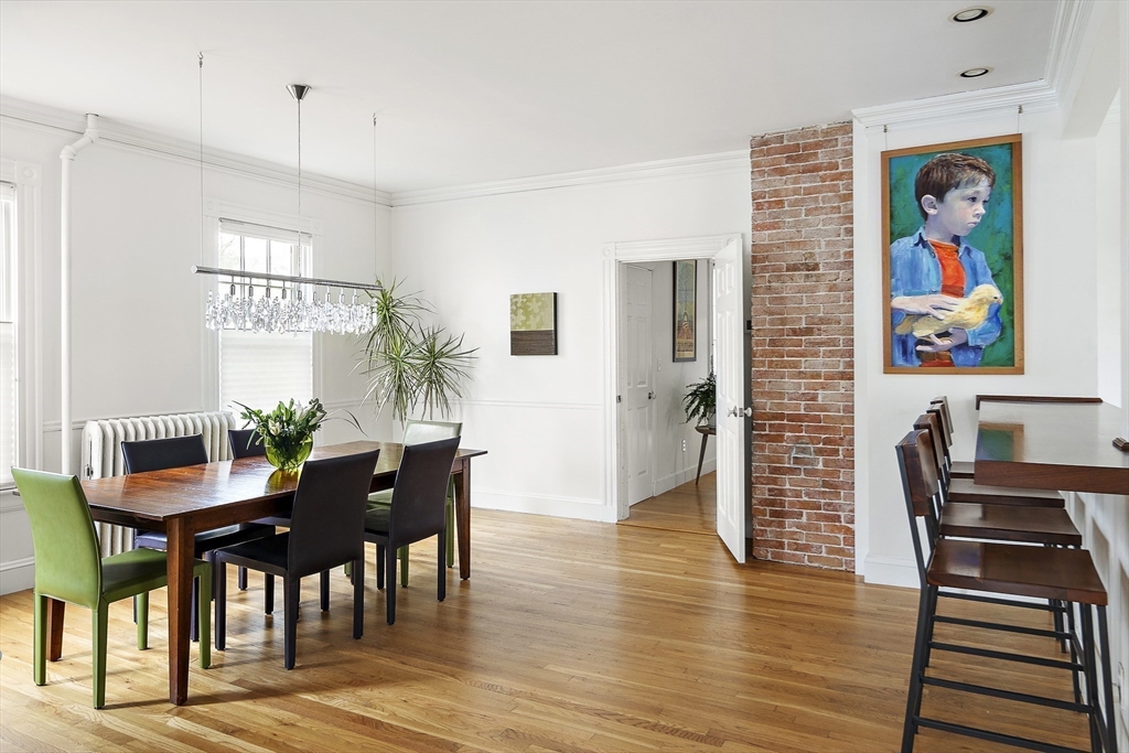 16 Blake Street Cambridge, MA 02140 - Photo 6 of 37 a view of a dining room with furniture wooden floor and a chandelier