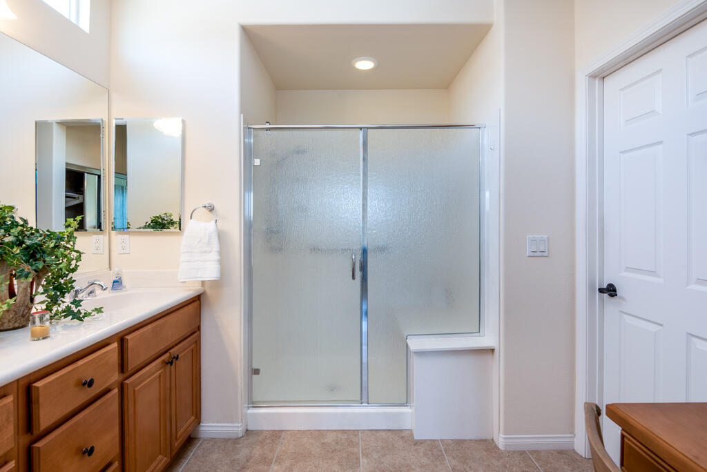 81820 Eagle Claw Drive La Quinta, CA 92253 - Photo 13 of 36 a bathroom with a shower and a sink
