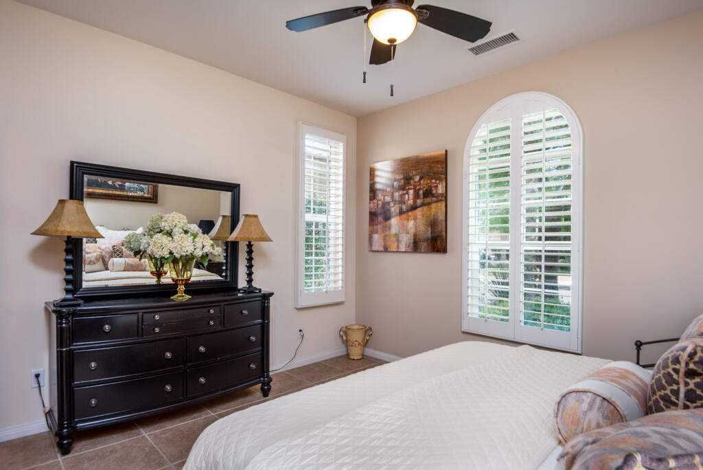 81820 Eagle Claw Drive La Quinta, CA 92253 - Photo 18 of 36 a bedroom with a bed and a window
