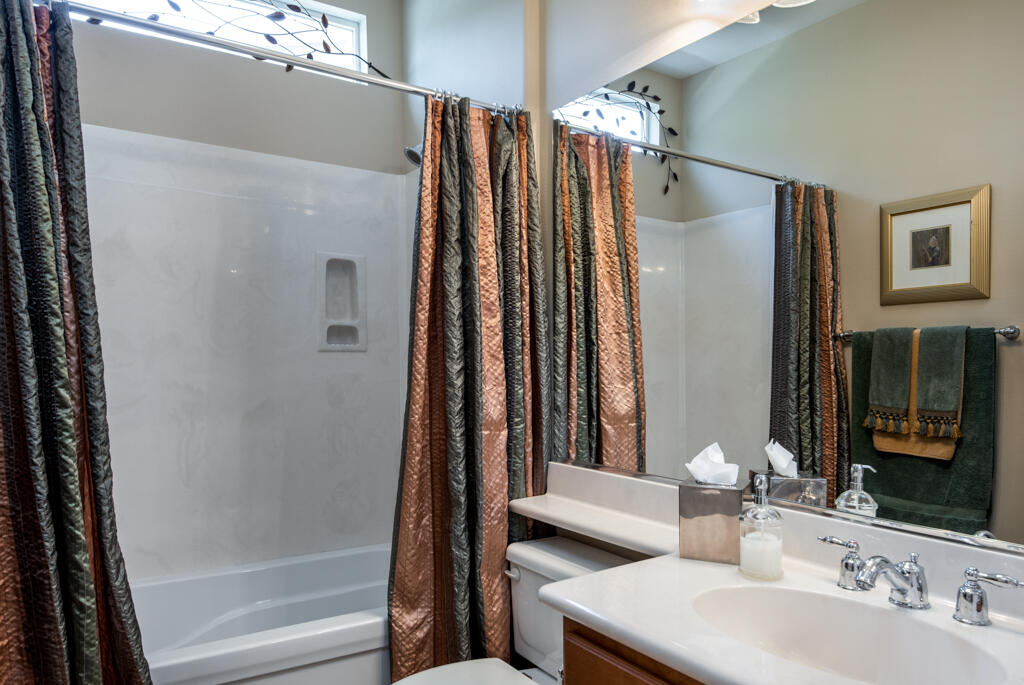 81820 Eagle Claw Drive La Quinta, CA 92253 - Photo 19 of 36 a bathroom with a double vanity sink and a mirror