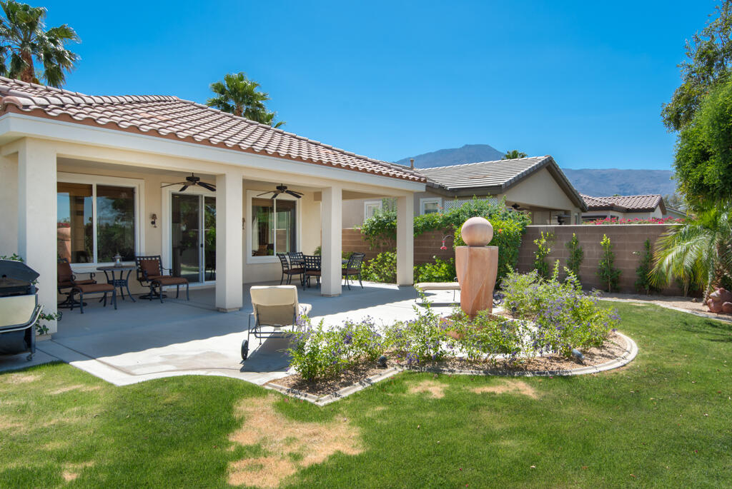 81820 Eagle Claw Drive La Quinta, CA 92253 - Photo 22 of 36 a front view of a house with swimming pool and porch