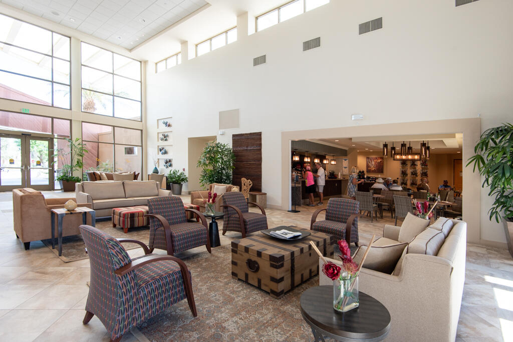 81820 Eagle Claw Drive La Quinta, CA 92253 - Photo 28 of 36 a living room with furniture a rug and a large window