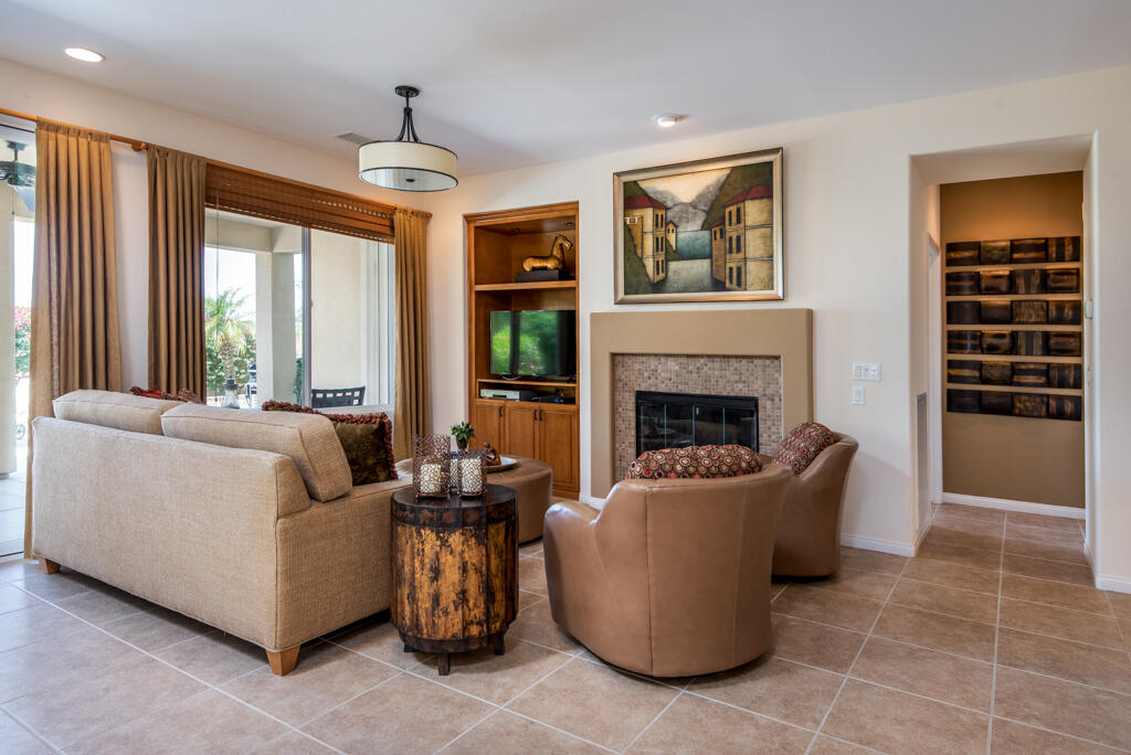 81820 Eagle Claw Drive La Quinta, CA 92253 - Photo 3 of 36 a living room with furniture and a fireplace